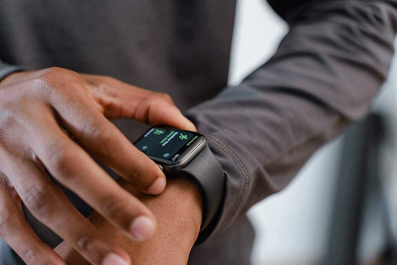 black smart watch in hand
